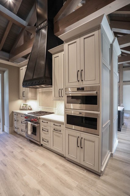Timber frame kitchen with statement black range hood
